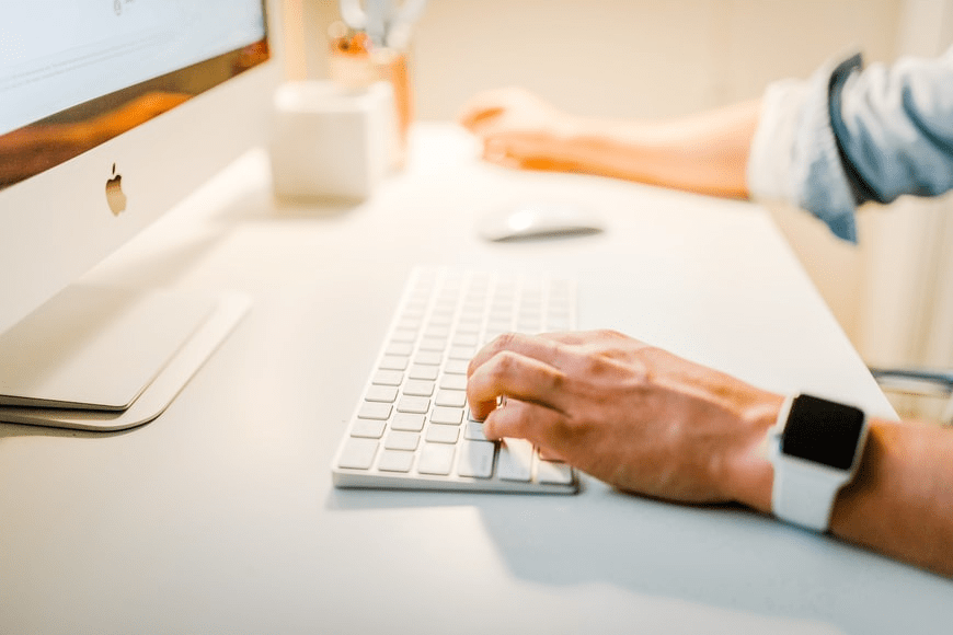 A person using a laptop to debug code for an e-commerce website.